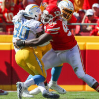 Chargers Running Back Stopped by Chiefs Defender
