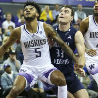 Huskies Player Goes For Rebound