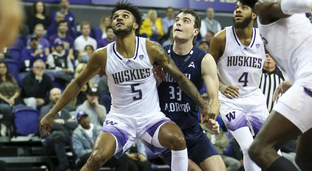 Huskies Player Goes For Rebound